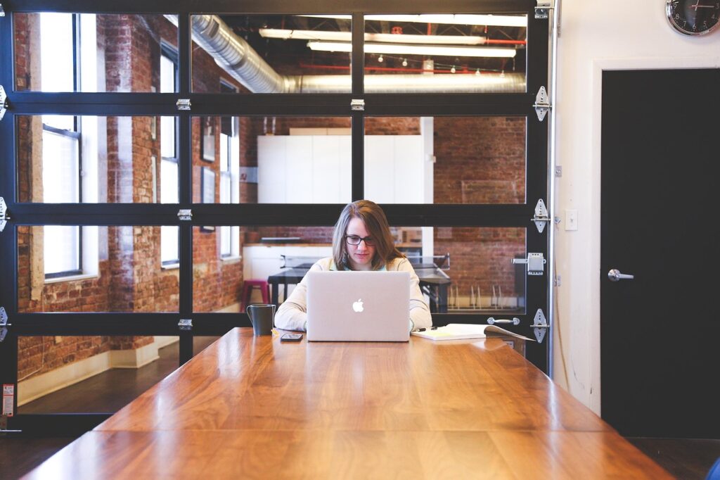 Woman typing on a keyboard