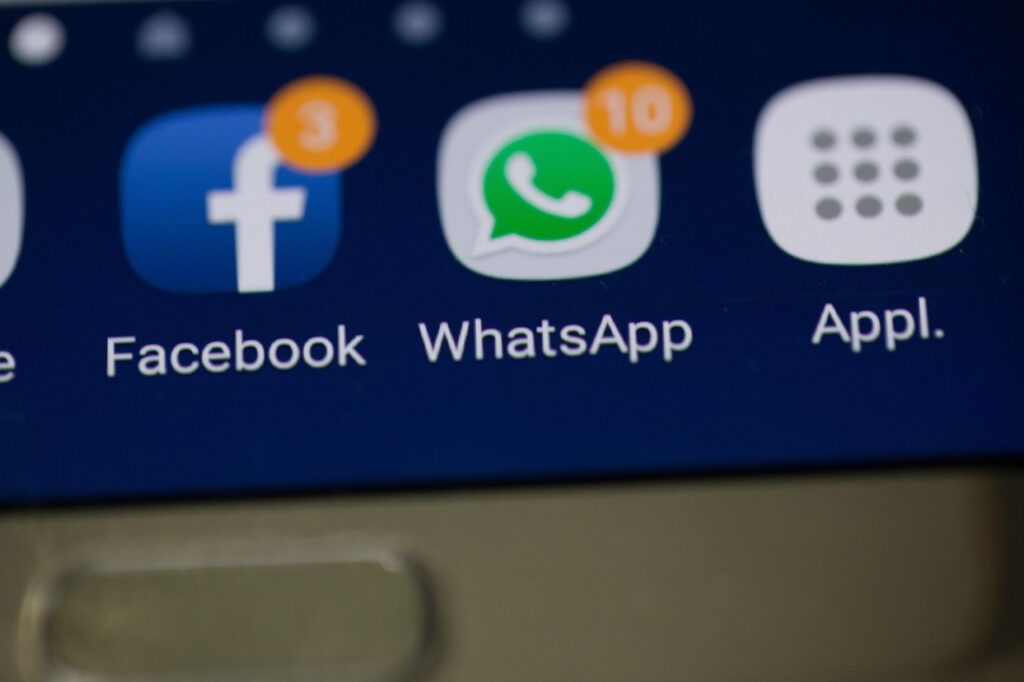 Social media logos: Facebook, WhatsApp