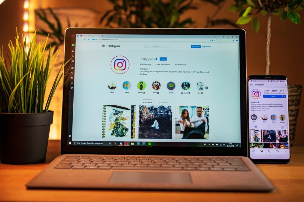 Laptop and mobile displaying Instagram
