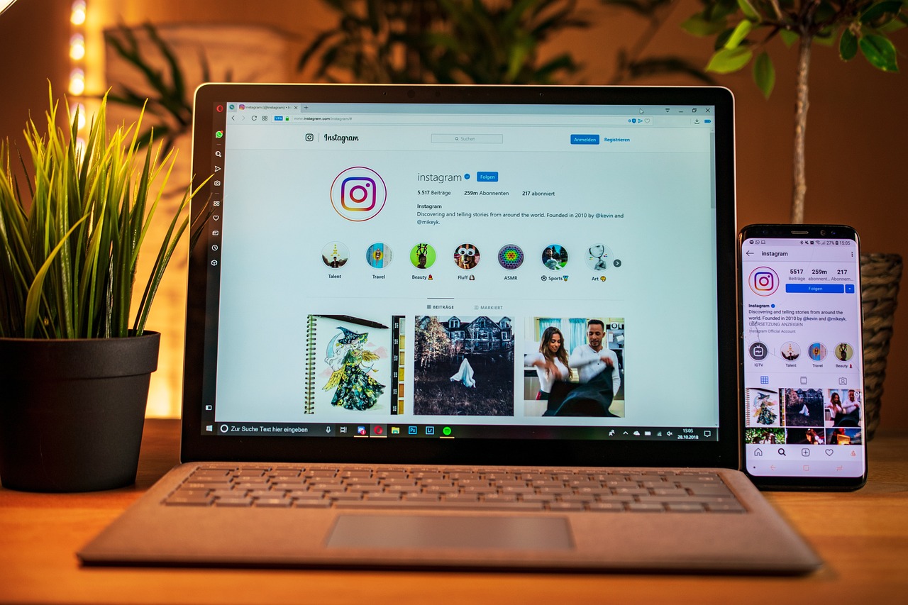 Laptop and mobile displaying Instagram